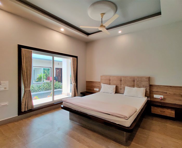 Elegant Deluxe Room at The Destiny Resort in Sasan Gir, featuring modern furnishings, luxury amenities, and serene decor for a comfortable and relaxing stay